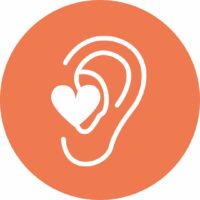 Icon of an ear with a heart in it, representing mindful listening
